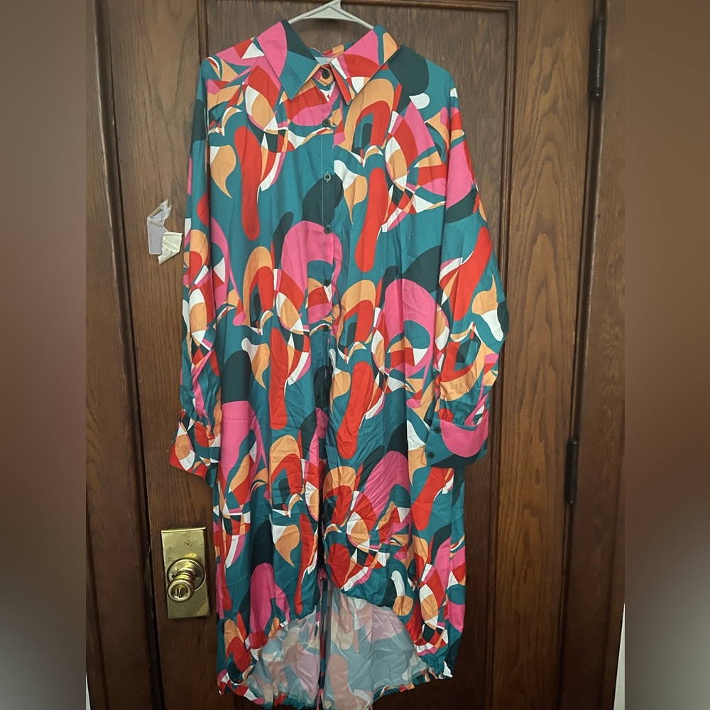 A vibrant shirt dress that ties at the bottom